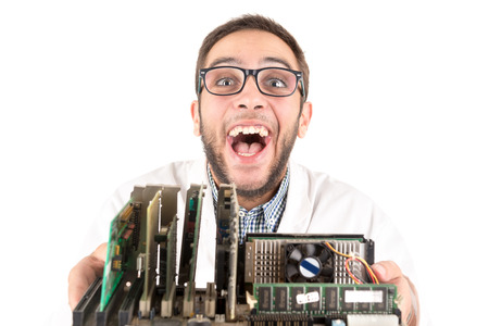 Nerd engineer posing with computer components isolated in a white backgroundの写真素材