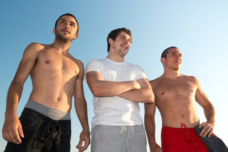 Group of happy boys at the beachの写真素材
