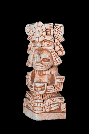 Mayan statue isolated against a black backgroundの写真素材