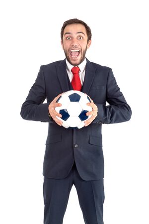 Businessman with soccer ball posing isolated in whiteの写真素材