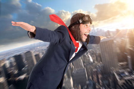 Businessman with homemade rocket and googles ready for a challenge