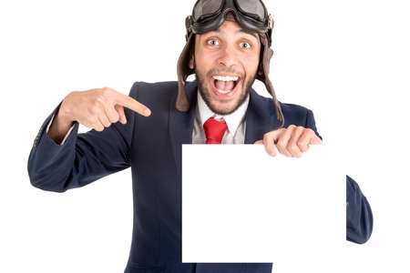 Businessman with pilot goggles and white board isolated in whiteの写真素材