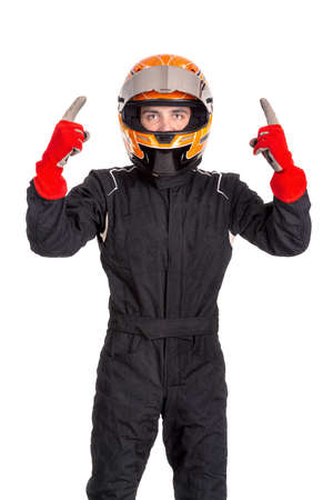Victorious racing driver posing with helmet isolated in whiteの写真素材