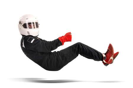 Racing driver in racing position with complete gear isolated in whiteの写真素材