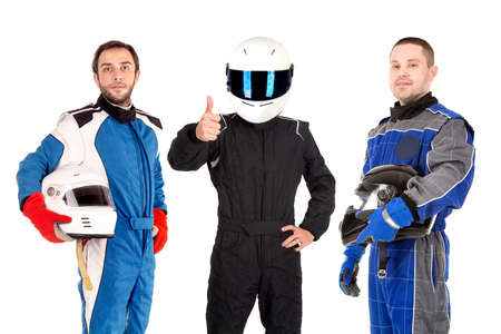 Racing drivers posing with helmets isolated in whiteの写真素材