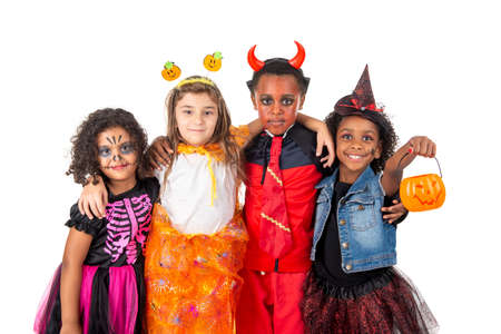 Group of kids in Halloween/Carnaval costumes isolatedの写真素材