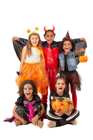 Group of kids in Halloween/Carnaval costumes isolatedの写真素材