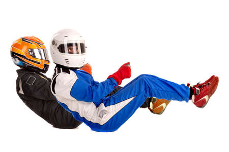 Racing drivers in racing position with complete gear isolated in whiteの写真素材