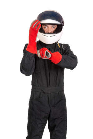 Racing driver putting on his gloves with helmet isolated in whiteの写真素材
