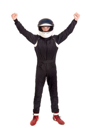 Victorious racing driver posing with helmet isolated in whiteの写真素材