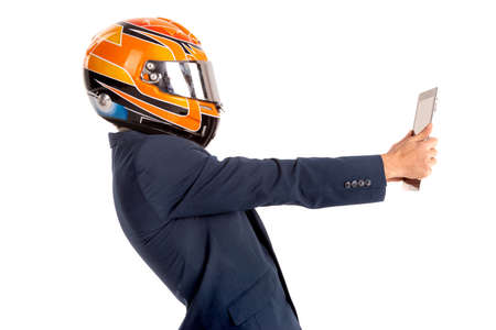 Businessman with pilot goggles, helmet and tablet isolated in whiteの写真素材