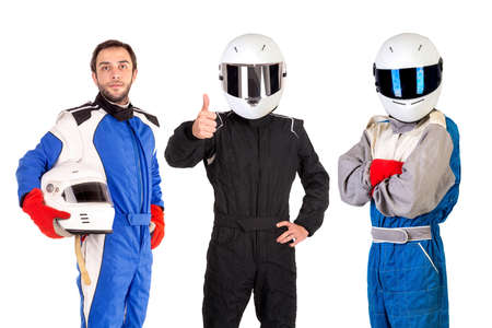 Racing drivers posing with helmets isolated in whiteの写真素材