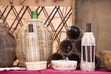 wine bottles lined wickerの写真素材