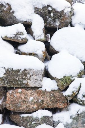 stone wall with snowの写真素材
