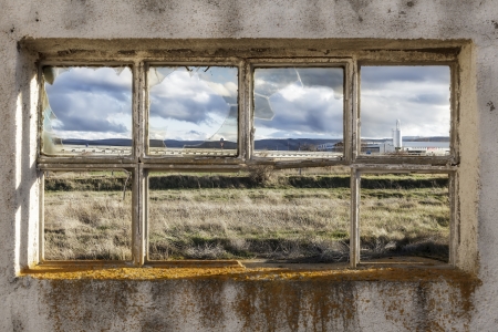 window of a ruined factoryの写真素材