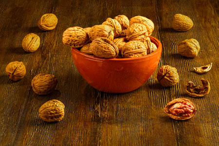 Bowl of Walnuts on Rustic Wooden Table