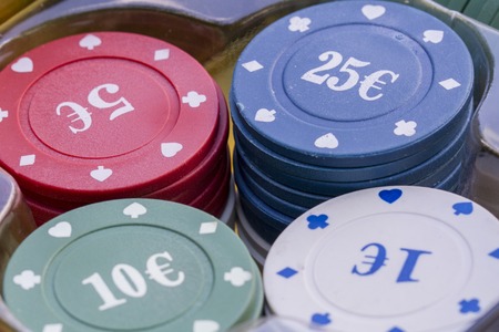 Group of poker chips on the green cloth.