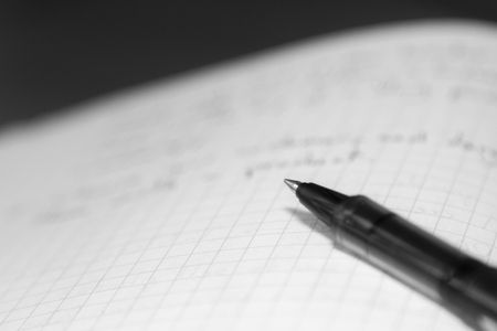 black pen on blank note bookの写真素材