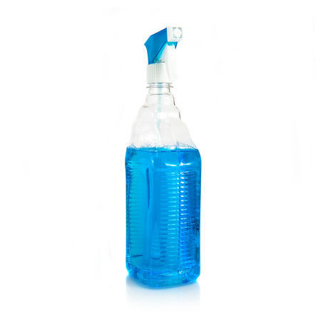 Glass cleaner with blue liquid inside over white backgroundの写真素材