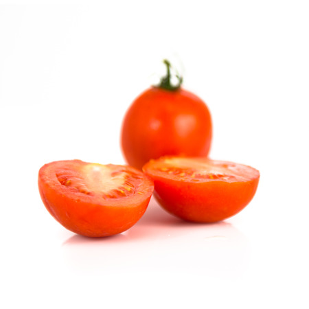 Red tomato isolated over white backgroundの写真素材