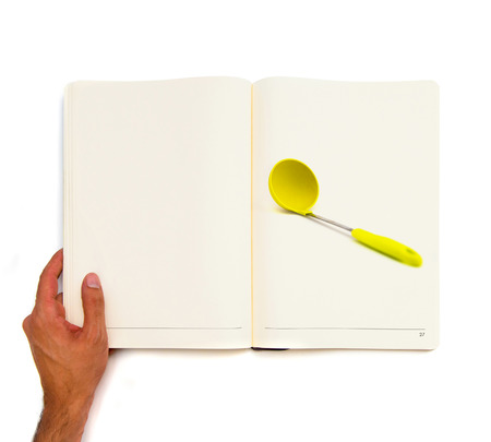 Big spoon printed on white book の写真素材