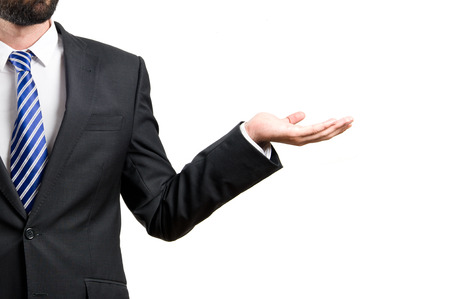 Businessman holding something over isolated white background の写真素材