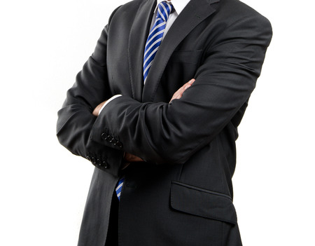 Business man with his arms crossed over isolated background の写真素材