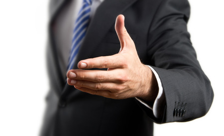businessman making a deal over isolated white background の写真素材