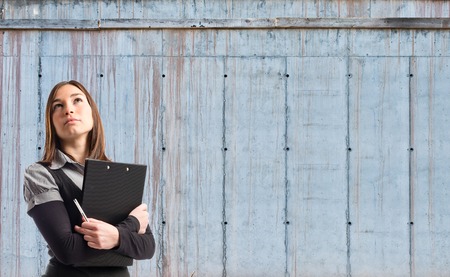 Young student thinking over cement の写真素材