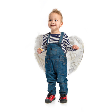 Cute kid with wings over white background の写真素材