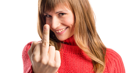 happy girl making horn gesture over white background の写真素材