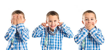Kid covering his mouth, his ears, and his eyes の写真素材