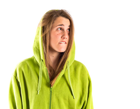 Girl thinking over isolated white backgroundの写真素材