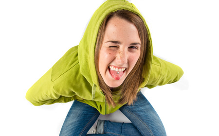 Young girl doing a joke over isolated white background 