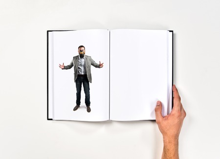 young businessman with gas mask printed on bookの写真素材