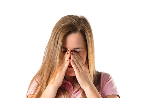 frustrated girl over isolated white backgroundの写真素材