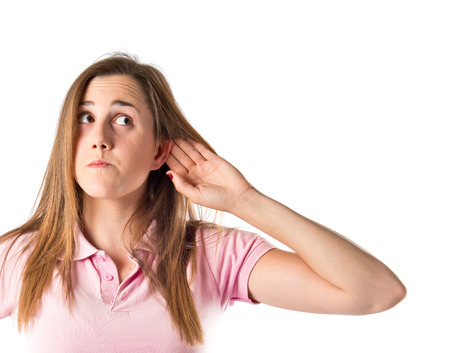 Girl listening over isolated white background