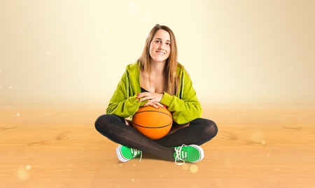 Pretty young girl wearing urban style with basketballの写真素材