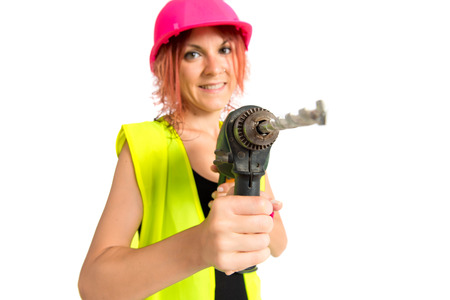 Worker woman with drill over white backgroundの写真素材