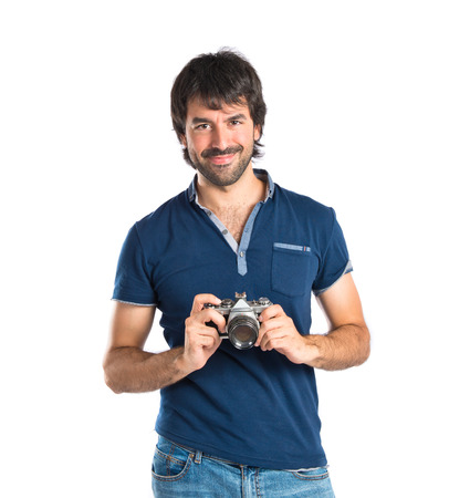 Man photographing over white backgroundの写真素材