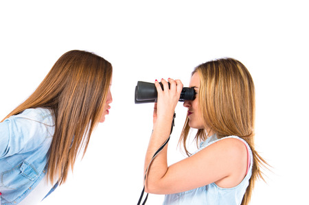 Friends with binoculars over isolated white backgroundの写真素材