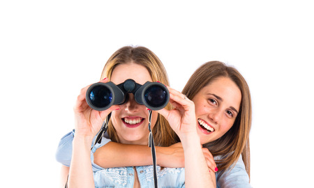 Friends with binoculars over isolated white backgroundの写真素材