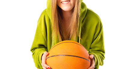 Blonde girl playing basketball over white backgroundの写真素材