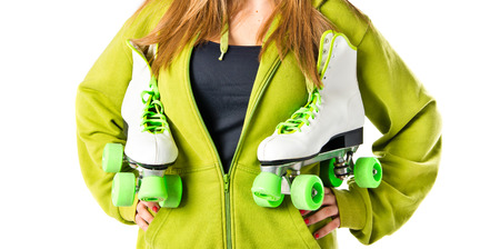 Girl with rollerskate over white backgroundの写真素材
