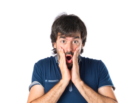 Man doing surprise gesture over white backgroundの写真素材