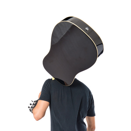 Handsome man with guitar over white backgroundの写真素材