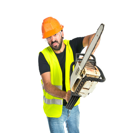 Workman with chainsaw over white backgroundの写真素材