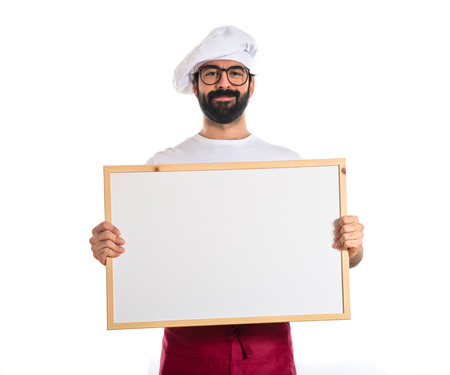 Happy chef holding empty placardの写真素材