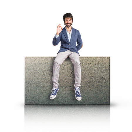 Man holding a clock over white の写真素材