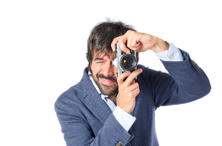 Man photographing over white backgroundの写真素材